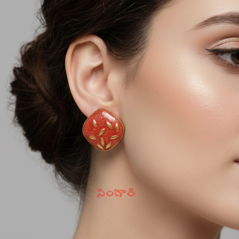 Close-up of a woman wearing a red floral earring against a neutral background