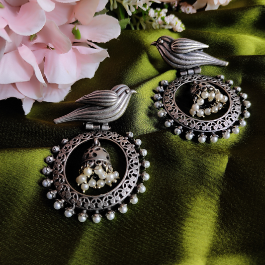 Bird motif brass based silver earrings