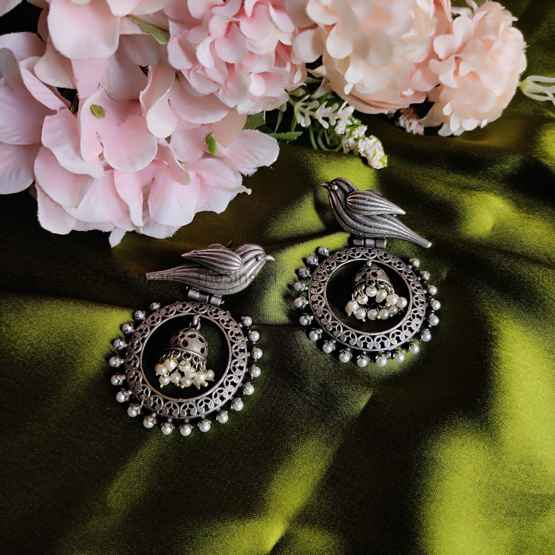 Bird motif brass based silver earrings