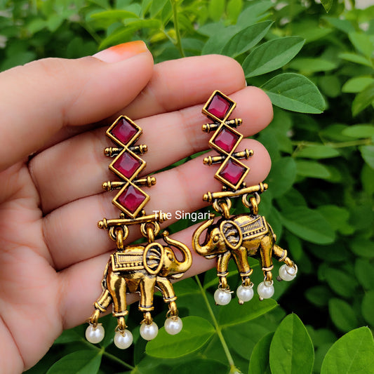 Long elephant motif earrings